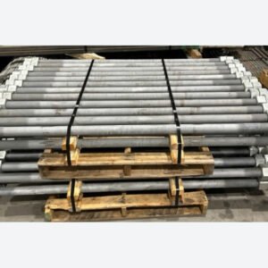 Reference photo of galvanized ASTM F1554 anchor bolts with nuts on pallets